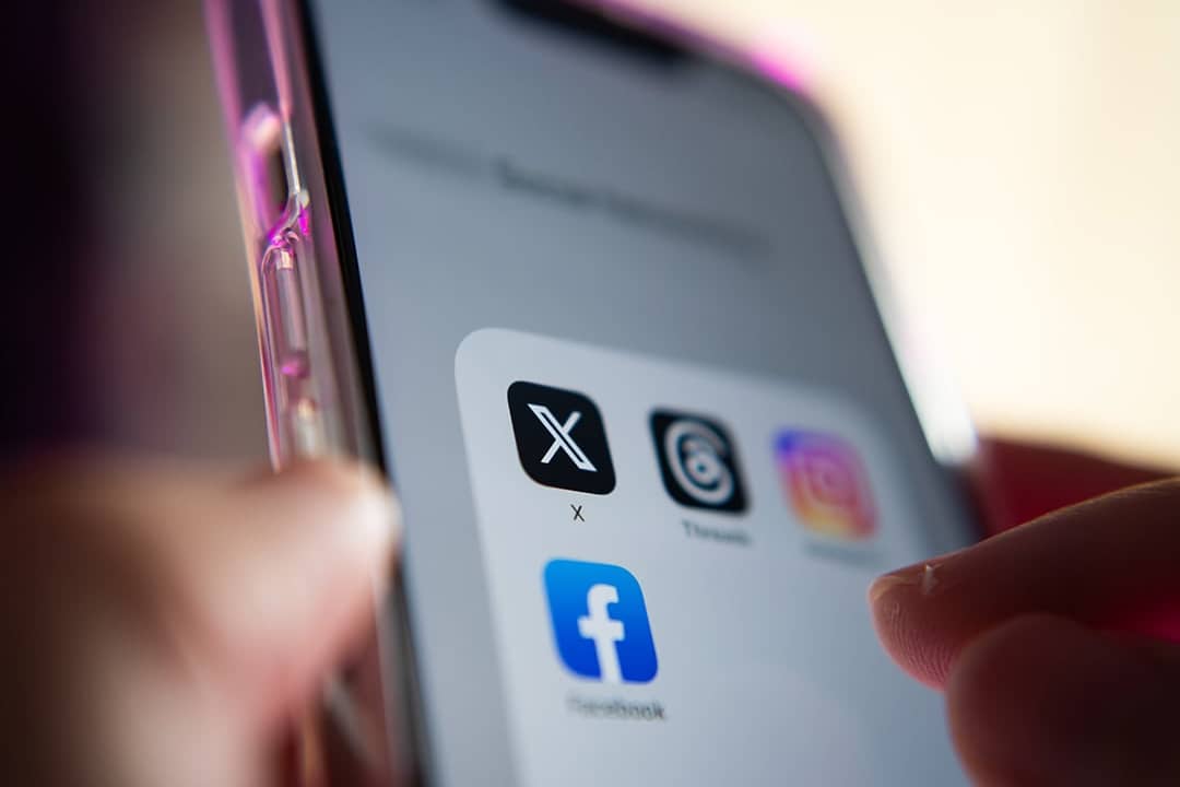 A mobile phone showing social media apps.
